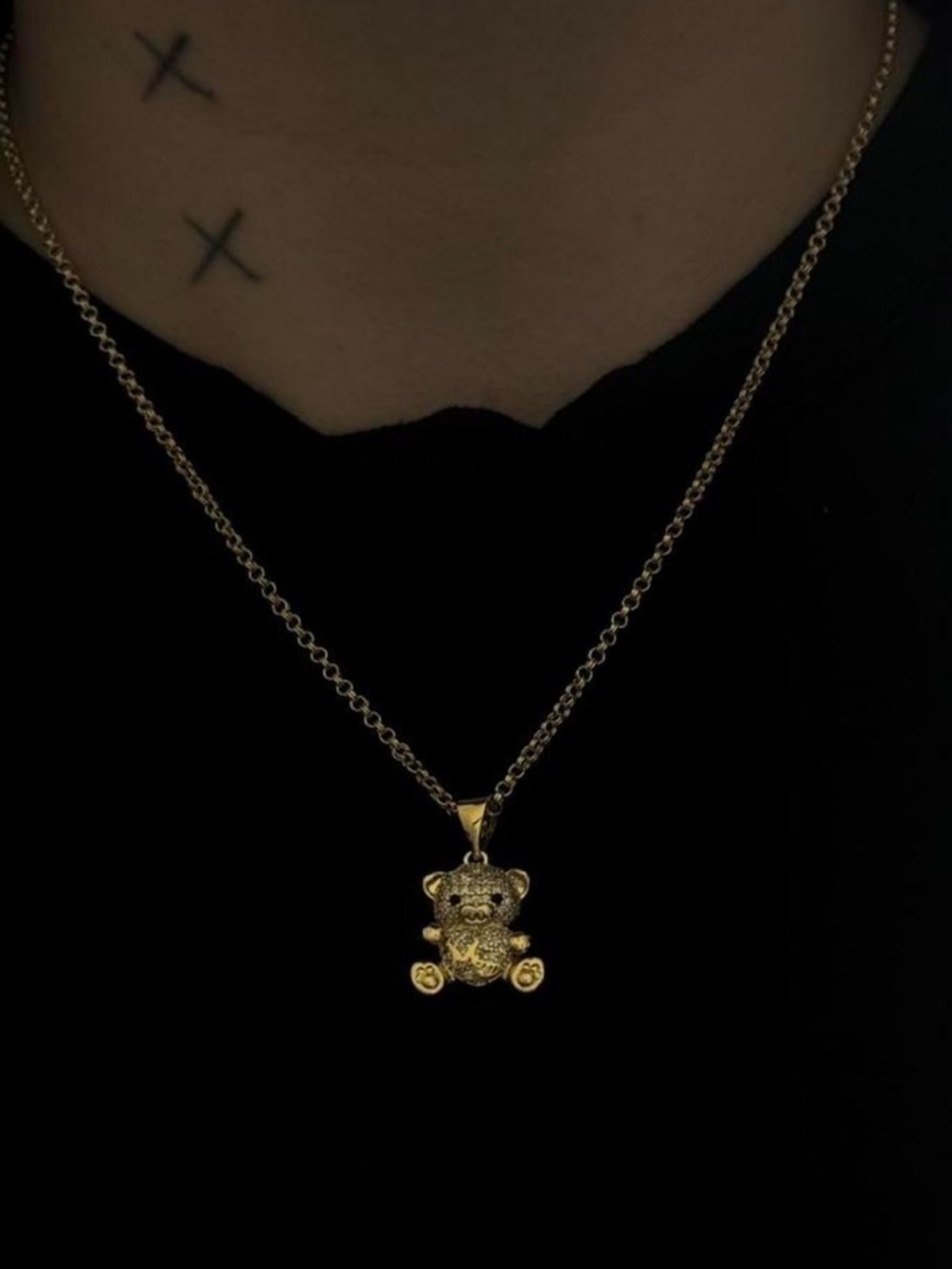 Gold chain with teddy bear pendant